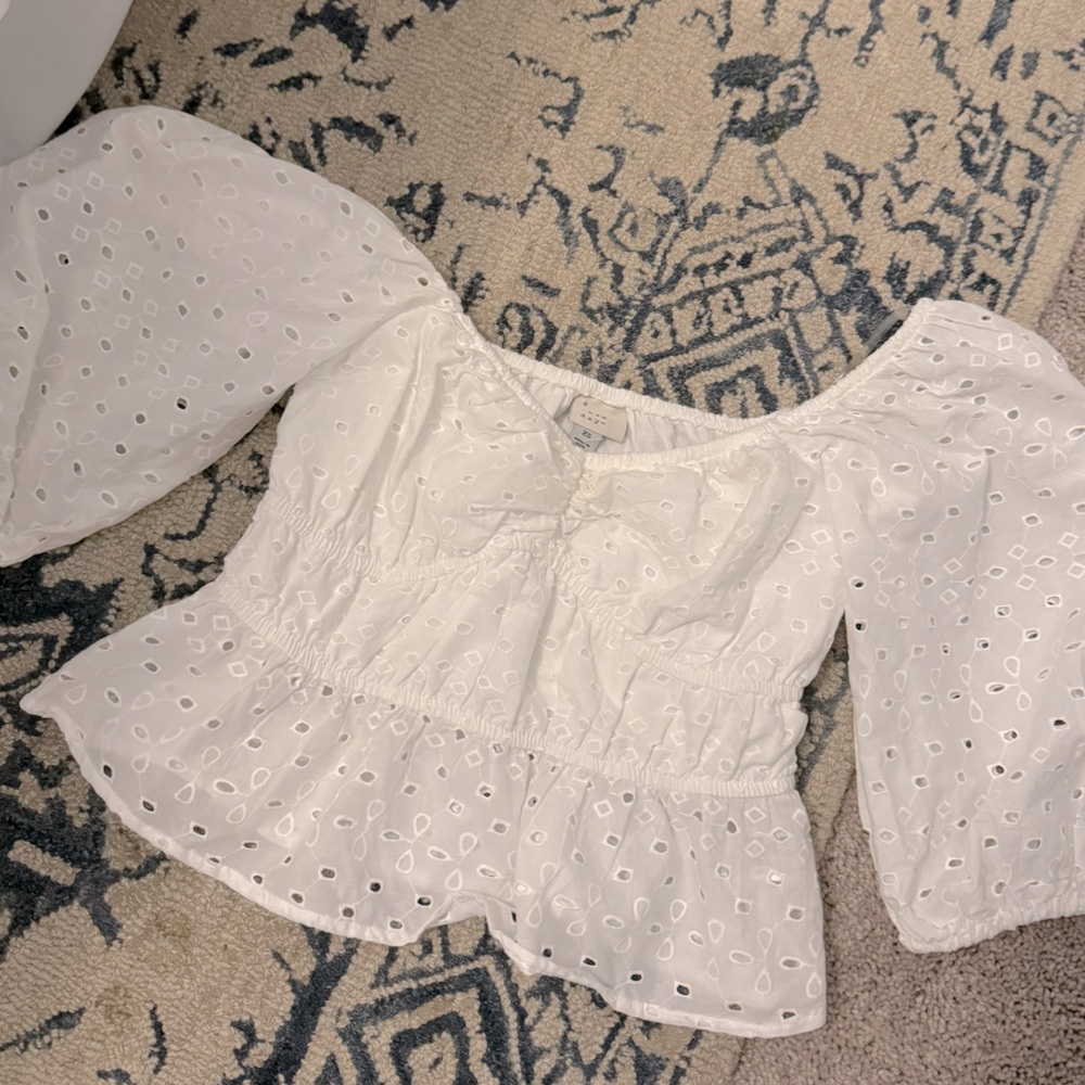 Eyelet off the shoulder peplum top